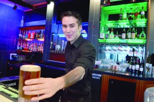 Bartender James Finnen serves up a beer at Krush Ultra Lounge at 10181 Old Olympic Highway in Sequim.  Joe Smillie/Peninsula Daily News