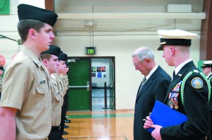 Port Angeles High Schools Navy Junior Reserve Officer Training Corps cadets stand at attention as retired Navy Cmdr. Gary Velie