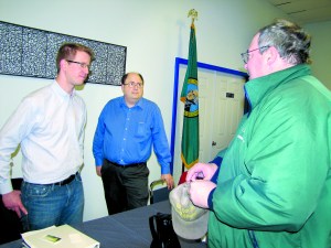 Bob Pensworth of Joyce talks to Congressman Derek Kilmer about communications issues in Neah Bay during a Wednesday visit to Forks