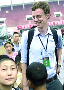 New York Times correspondent Austin Ramzy with schoolchildren before he was ordered out of China.  The Associated Press