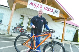 Mike Wanner of Mikes Bikes in Sequim is changing his shops name because a California chain trademarked the Mikes Bikes name.  -- Photo by Joe Smillie/Peninsula Daily News