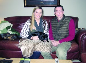 Port Angeles residents Katharine and Tyler Bieker welcomed their cat Max home 15 months after it disappeared.