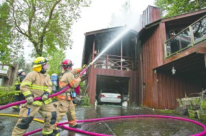A total of 23 firefighters from East Jefferson Fire-Rescue and Indian Island Station 91 responded to this residential fire at Kala Point on Friday. -- Photo by Crystal Craig Photography