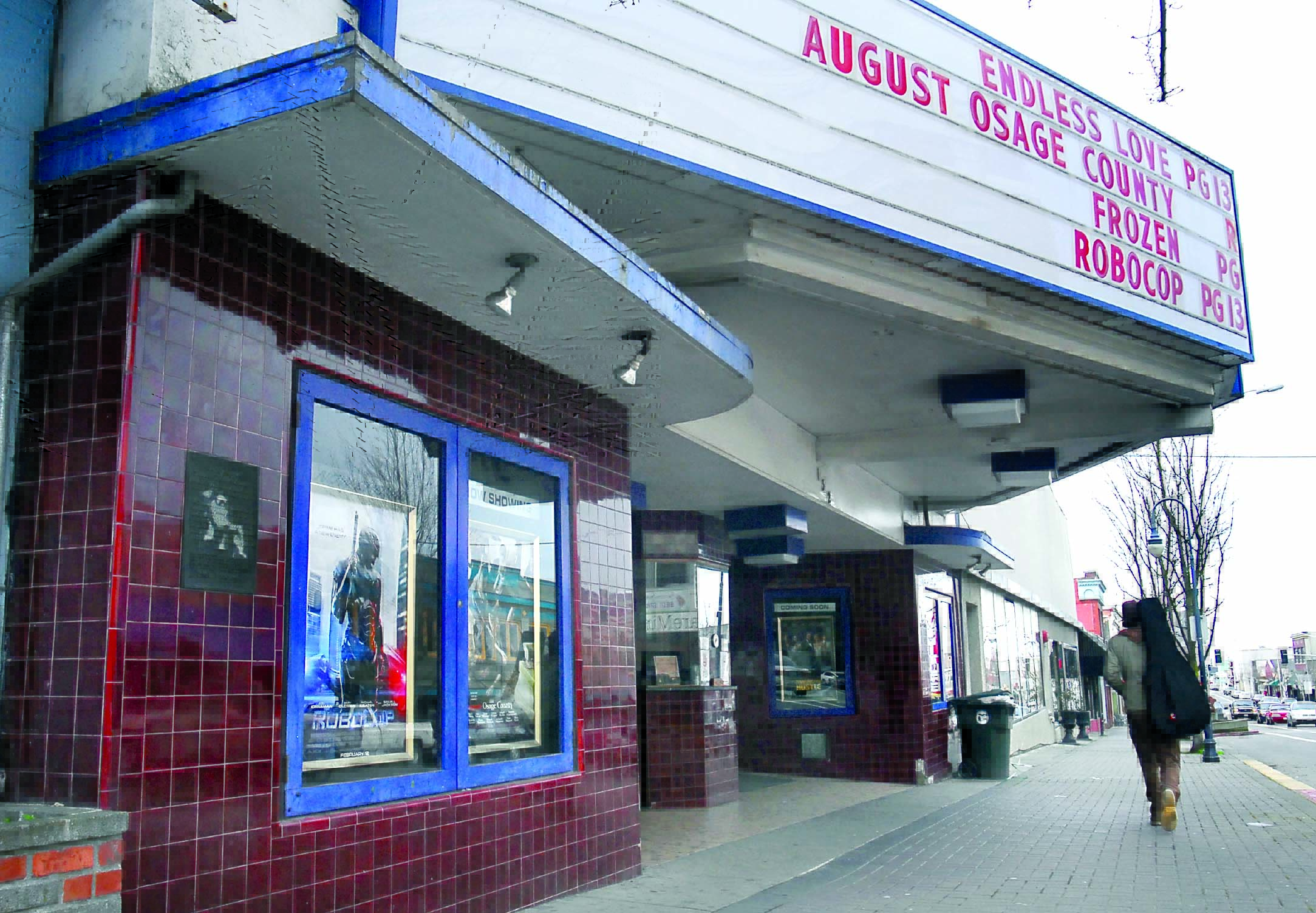 Posters of current movies are displayed in front of the Lincoln Theater in Port Angeles on Wednesday as the marquee advertises the last movies to be shown in the 98-year-old cinema.  Keith Thorpe/Peninsula Daily News