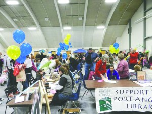 Balloons brighten the Vern Burton Community Center around the Port Angeles Friends of the Library table during the 2012 KidsFest.