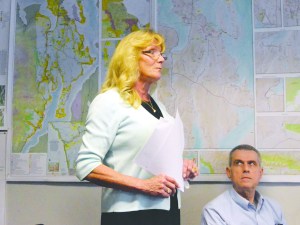 Jefferson County Auditor Donna Eldridge speaks out in support of a salary increase for Jefferson County commissioners at a meeting Monday as Tom Thiersch listens.  Charlie Bermant/Peninsula Daily News