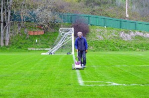 Jefferson County employee Irene Miller paints the lines on Memorial Field in anticipation of a soccer game on Tuesday. The field will be used for the Rhody Fest carnival in May.  Photo by Charlie Bermant/Peninsula Daily News