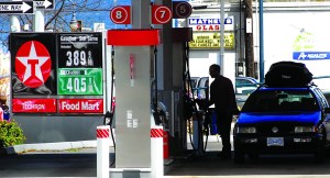 A motorist buys fuel at the Texaco Food Mart at First and Lincoln streets in Port Angeles.  Photo by Keith Thorpe/Peninsula Daily News