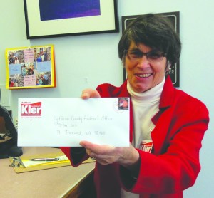 Kathleen Kler mails her candidacy papers for a Jefferson County commissioners seat Monday in Quilcene.