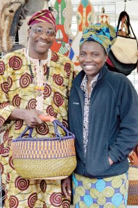Vendors Ade and Priscilla Okunuga at the Juan de Fuca Festival of the Arts street fair. —Photo by Diane Urbani de la Paz/Peninsula Daily News