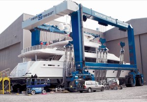 A new 164-foot Westport yacht sits in the slings of a TraveLift outside the companys factory in Port Angeles in 2012. Westport Shipyard has been sold to a Louisiana-based company.  Photo by Keith Thorpe/Peninsula Daily News