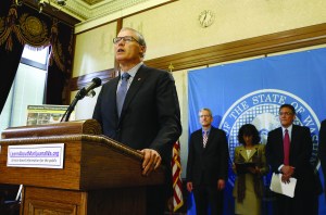 Gov. Jay Inslee speaks to the media Tuesday in Olympia about public awareness and safety efforts the state is making in advance of the start of retail sales of recreational marijuana.  The Associated Press