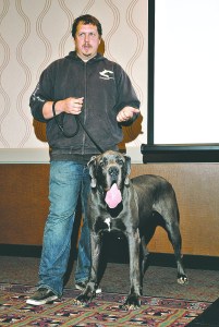Steve Markwell is shown with one of his shelter dogs during a presentation to the Port Angeles Regional Chamber of Commerce in 2012.  -- Peninsula Daily News photo