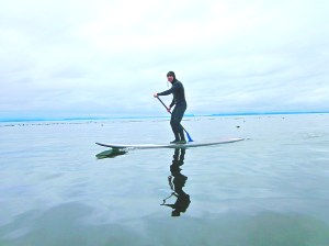 Darren Bachiu on his stand-up paddleboard. He intends to cross the Strait of Juan de Fuca