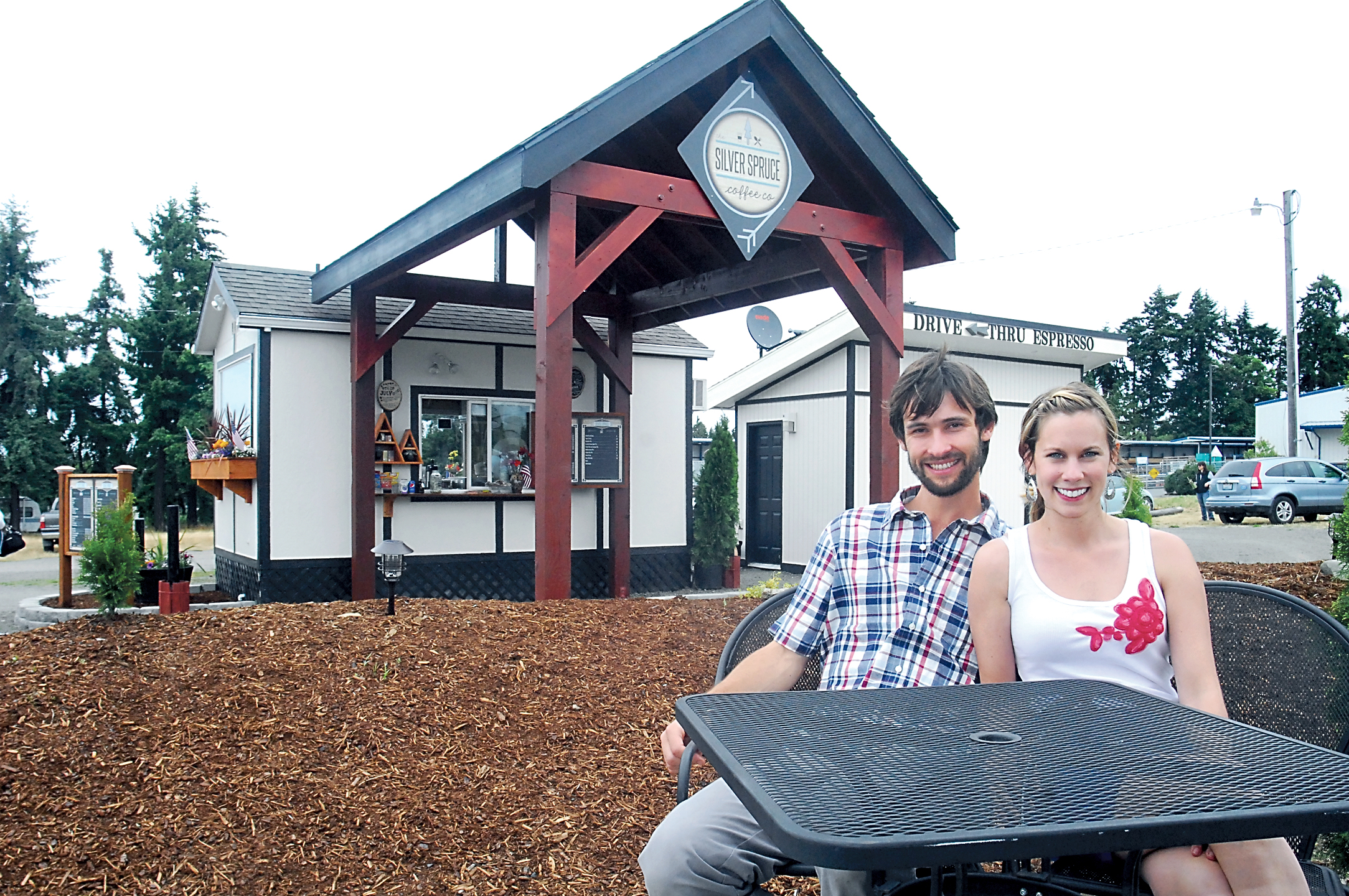 Silver Spruce Coffee Co. owners Casey and Taria Nagler sit in front of their drive-through coffee/espresso and food business off U.S. Highway 101 in east Port Angeles. Keith Thorpe/Peninsula Daily News