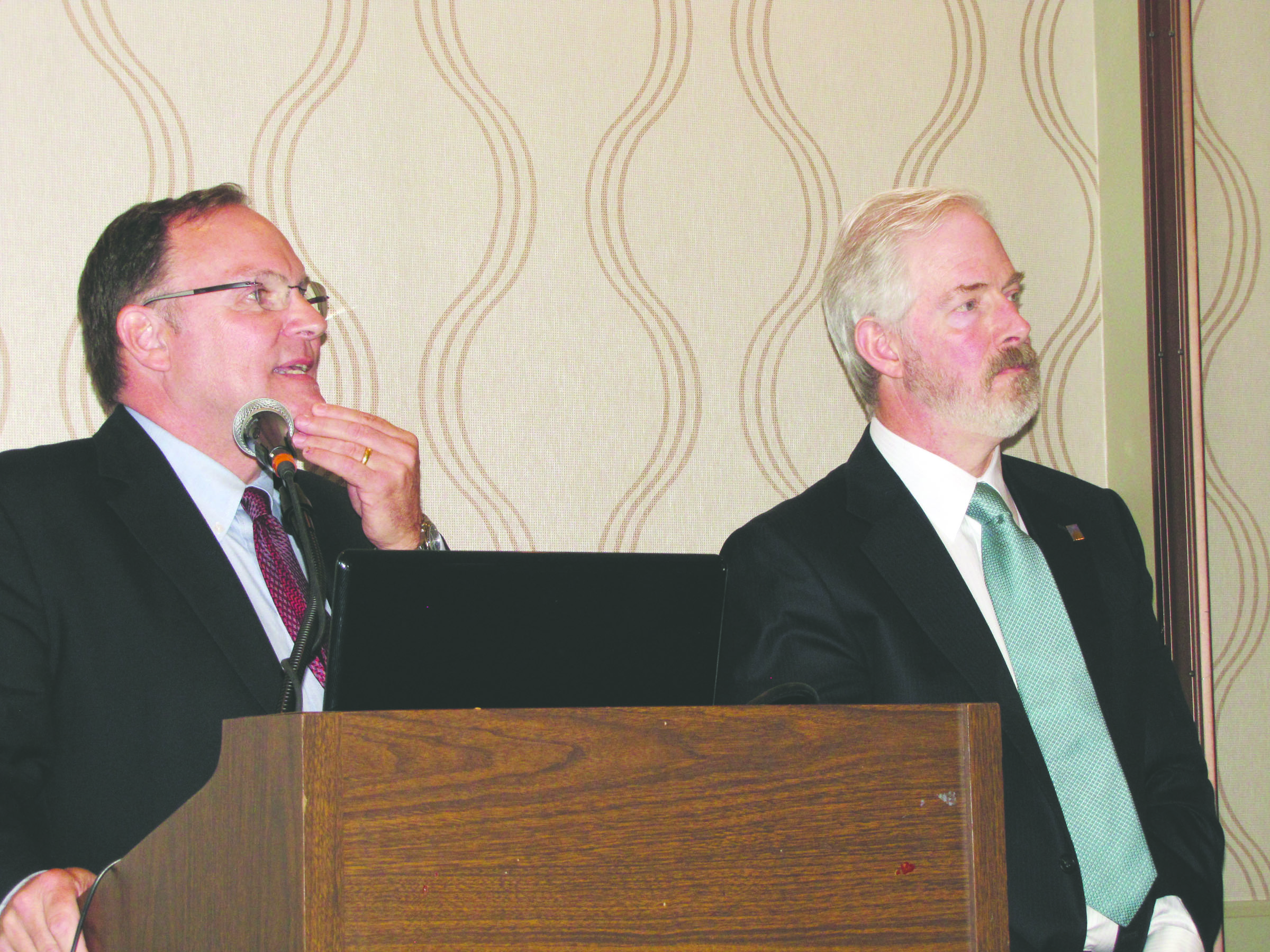 Port of Port Angeles Executive Director Ken OHollaren answers a question as Commissioner Jim Hallett listens during a presentation on the ports economic impact study at the Port Angeles Regional Chamber of Commerce meeting Monday.  Arwyn Rice/Peninsula Daily News