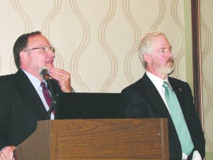 Port of Port Angeles Executive Director Ken OHollaren answers a question as Commissioner Jim Hallett listens during a presentation on the ports economic impact study at the Port Angeles Regional Chamber of Commerce meeting Monday.  Arwyn Rice/Peninsula Daily News