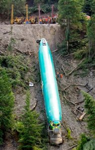 Crews pull up one of three Boeing 737 fuselages from the Clark Fork River in Montana.  Photo by The Associated Press