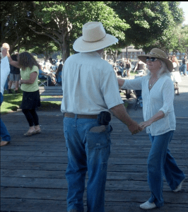Ann and Steve Johnson dance to the tunes of Haywire at last week's Concert on the Pier in Port Angeles. Peninsula Daily News