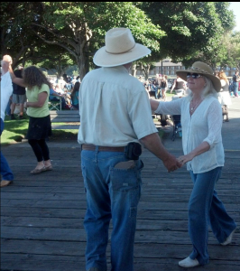 Ann and Steve Johnson dance to the tunes of Haywire at last week's Concert on the Pier in Port Angeles. Peninsula Daily News