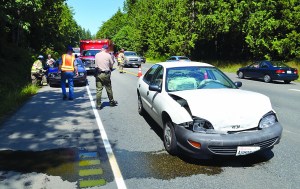 A wreck on U.S. Highway 101 at Schoolhouse Point Road briefly blocks traffic Monday. Clallam County Fire District No. 3