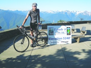 Lorne Guthro of Victoria was the first rider to the top in the 2013 Ride the Hurricane. He also was celebrating his birthday. Russ Veenema/Port Angeles Regional Chamber of Commerce