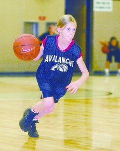 Millie Long of Port Angeles dribbles upcourt during an Olympic Avalanche practice at Peninsula College. The Avalanche is an elite team of 10-year-old girls from the North Olympic Peninsula who are in their first year playing together. Many players from a previous Avalanche team have gone on to play college sports.  --Photo: Keith Thorpe/Peninsula Daily News