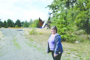 Maggie Wilkinson stands in her front yard