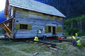 Workers on Sunday ready the steel beams used to move the Enchanted Valley chalet in Olympic National Park. National Park Service