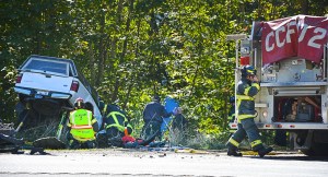 Emergency responders at the scene of a two-vehicle wreck on U.S. Highway 101 near Lake Sutherland on Sunday. Clallam County Fire District No. 2