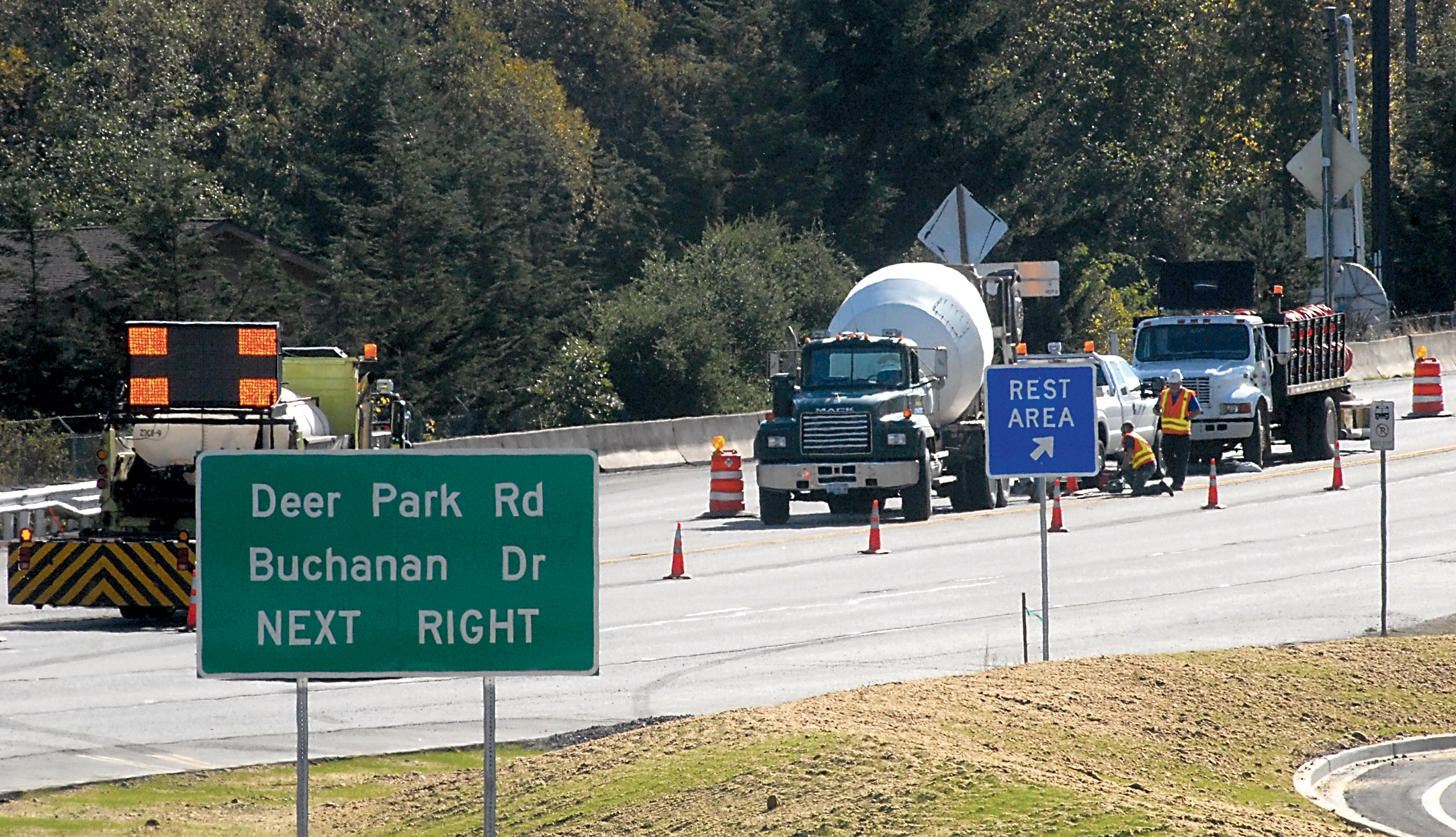 Signs indicate new traffic routing as crews work on the road surface on U.S. Highway 101 at Deer Park Road east of Port Angeles on Wednesday. Keith Thorpe/Peninsula Daily News