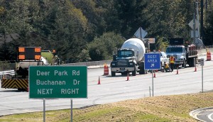 Signs indicate new traffic routing as crews work on the road surface on U.S. Highway 101 at Deer Park Road east of Port Angeles on Wednesday. Keith Thorpe/Peninsula Daily News