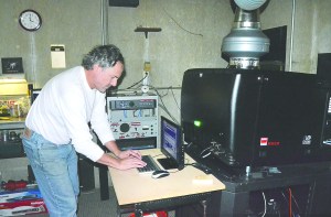 Uptown Theatre owner Rick Wiley operates the newly installed digital projector at the Port Townsend cinema.  Photo by Charlie Bermant/Peninsula Daily News
