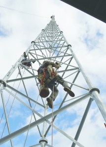 Workers with the North Star Broadcasting Co. tighten bolts on KSQMs new 155-foot transmission tower Monday.  -- Photo by Joe Smillie/Peninsula Daily News