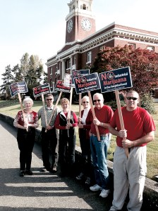 A group of demonstrators against industrial marijuana in rural residential neighborhoods stand outside the Clallam County Courthouse. From left are Lynne Clark