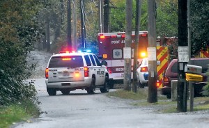 Police and medical vehicles converge at the base of the Eighth Street bridge over Valley Creek in Port Angeles after a person jumped from the bridge. Keith Thorpe/Peninsula Daily News