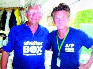 Sequim Rotarian Tom Schaafsma stands with actor Sean Penn during a Haiti relief effort in which Schaafsma assisted with placing Rotary ShelterBoxes in 2010. Schaafsma was severely injured Friday when a tractor flipped on him.