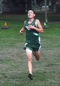 Port Angeles' Peter Butler approaches the finish line to take first at Lincoln Park in Port Angeles. Keith Thorpe/Peninsula Daily News