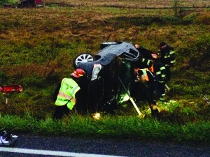Emergency responders at the scene of a rollover wreck Monday in Port Angeles. Clallam Fire-Rescue No. 2
