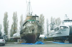 The Western Flyer sits on blocks in the Port Townsend Boat Haven boatyard