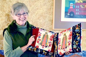 Judith Pasco of the Mujeres de Maiz Opportunity Foundation shows off Lyell Fox's pillows