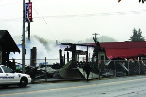 Burned rubble is all that remains of the IOOF hall and an adjacent store building that once housed Olympic Pharmacy  and more recently