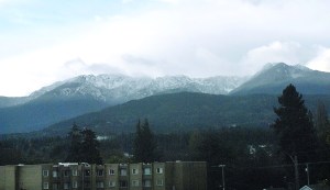 Klahhane Ridge south of Port Angeles emerges from the clouds Sunday morning to reveal a mantle of white