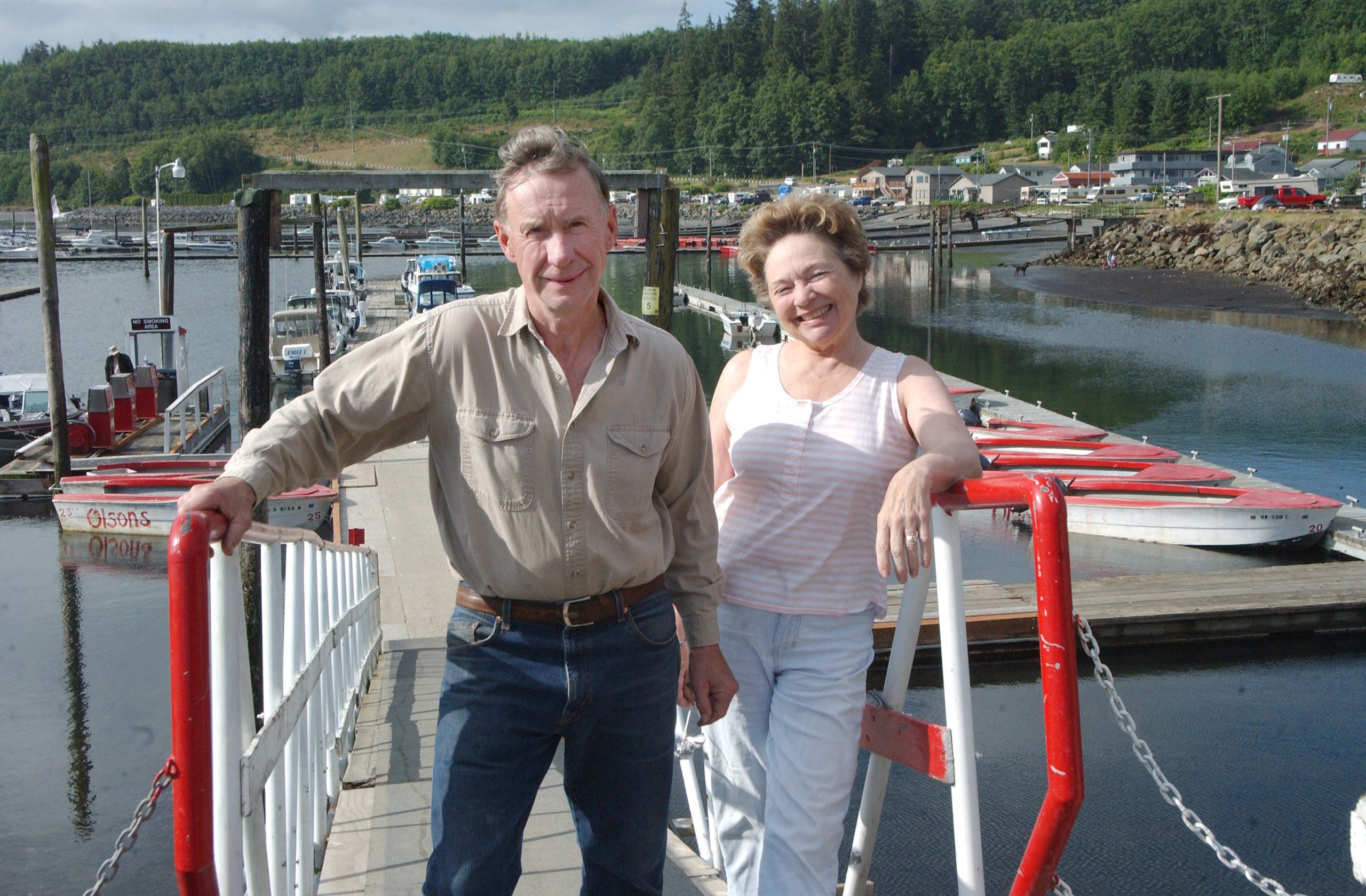 Arlen and Donalyn Olson stand at their Sekiu fishing resort last summer. The sale to an Idaho family was final last week. Photo by Lonnie Archibald/for Peninsula Daily News