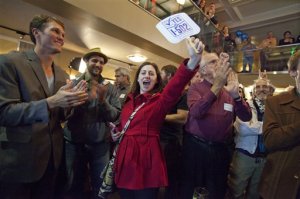 Supporters in Seattle celebrate after it's announced that an initiative legalizing marijuana apparently has passed.  -- Photo by Steve Ringman/The Seattle Times via The Associated Press