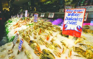 Precooked dungeness crabs from Washington state are offered for sale at Pike Place Fish Market in Seattle on Nov. 9. The Associated Press