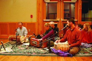 Members of Amma Satsang end Sundays interfaith service with a chant. From left: Saul Samsky