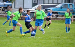Adrenaline's Jada Cargo and Kyrsten McGuffey team up to steal the ball from a Bremerton player.