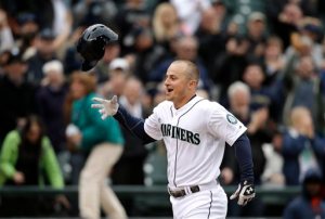 Seattle Mariners' Kyle Seager tosses his batting helmet as he heads home on his three-run walk-off home run against the Houston Astros in the ninth inning of a baseball game in Seattle last April. —Photo by Elaine Thompson/The Associated Press