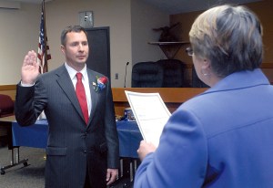 Incoming Clallam County Prosecuting Attorney Mark Nichols takes the oath of office from Clallam County Auditor Patty Rosand on Tuesday at the Clallam County Courthouse in Port Angeles. Keith Thorpe/Peninsula Daily News